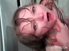 Tied up sex slave gets a bowl of piss poured on her face