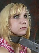 Blonde in metal bondage
